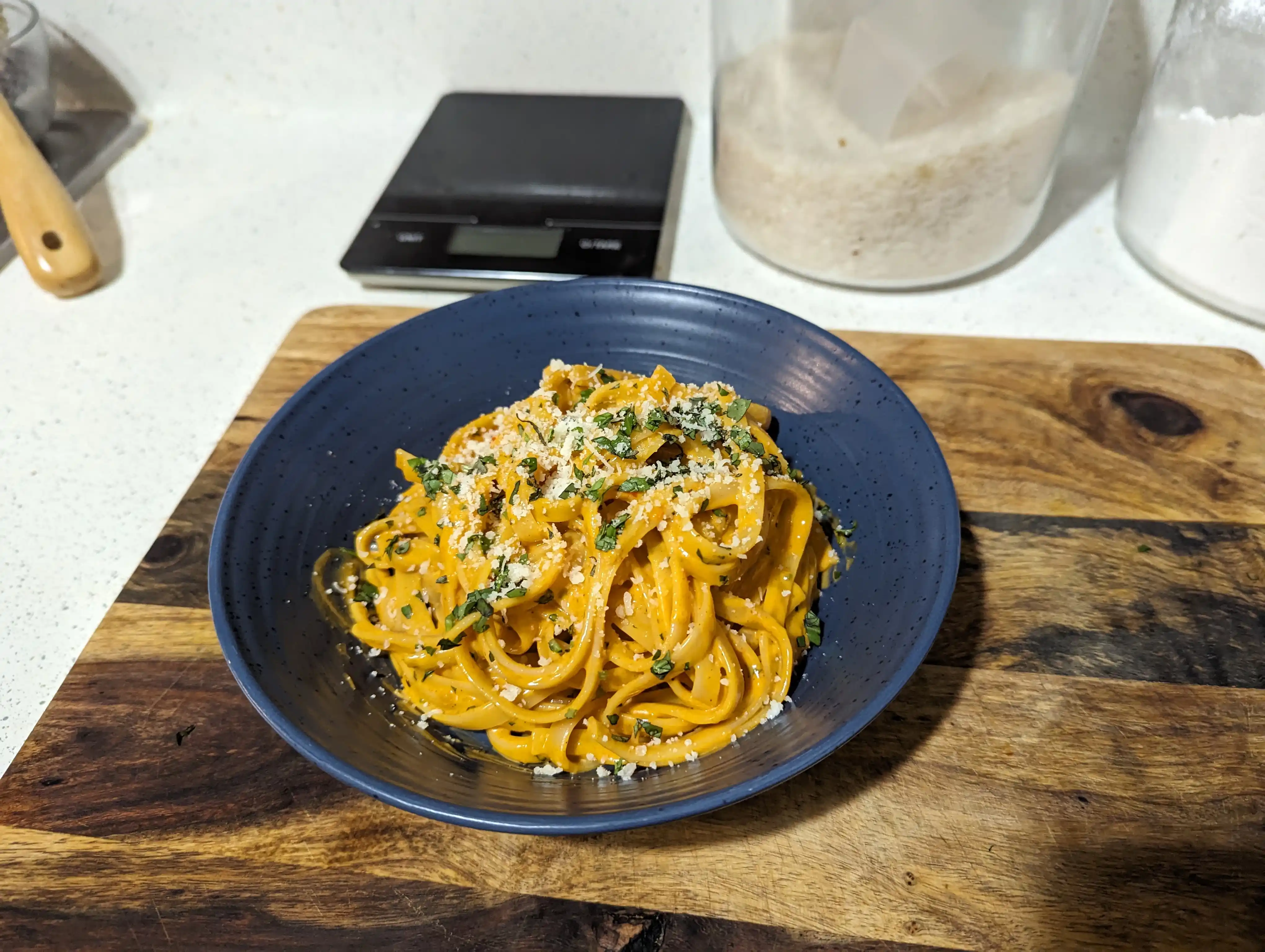 Bowl of Gochujang Alfredo garnished with Pecorino Romano
