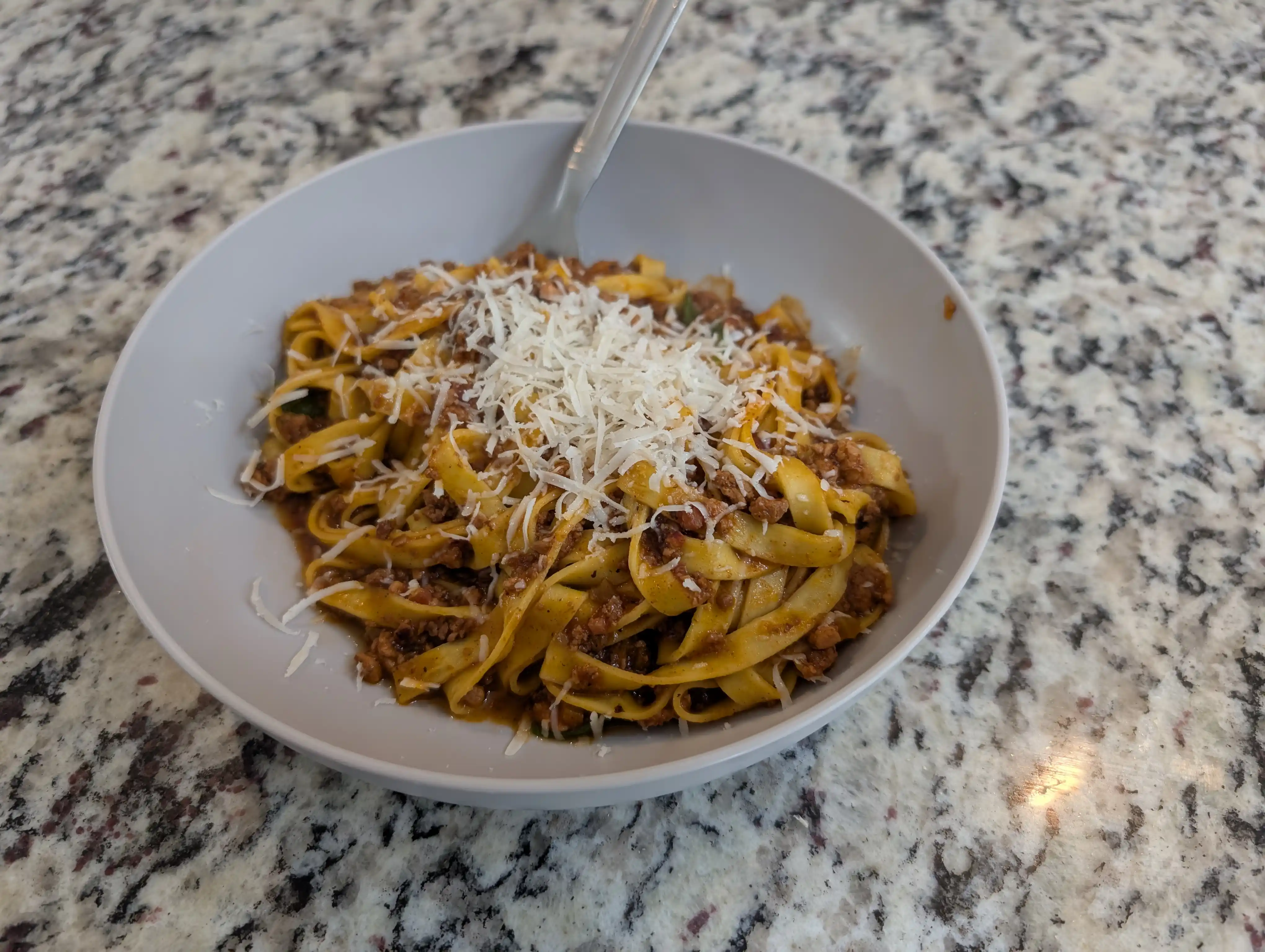 Ragu alla bolognese served on fettuccine with pecorino romano.